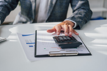 Portrait of bookkeepers asia business man working on tax consultant law in a modern office. Make an account analysis report. real estate investment information financial and tax system concepts