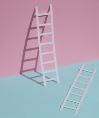 Paper ladders on a blue-pink pastel background. Creative layout, business, career growth concept