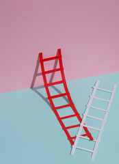 Paper ladders on a blue-pink pastel background. Creative layout, business, career growth concept