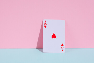 Ace of hearts on a blue-pink pastel background. Creative gambling layout
