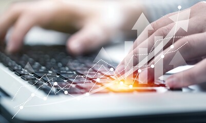 Hand on computer with 2023 numbers, digital trends