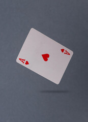 Obraz premium Ace of hearts levitating on a gray background
