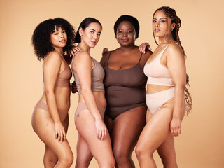 Body, skin and diversity women portrait of group together for inclusion, beauty and power. Underwear model friends hug on beige background with skincare, color pride and motivation for self love