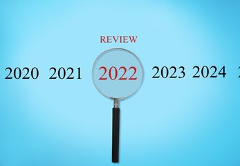 Magnifying glass with 2022 numbers review