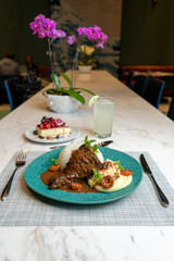 Steak in the pot with mashed potatoes, typical food from Peru.
