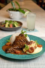 Steak in the pot with mashed potatoes, typical food from Peru.