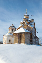 Two ancient churches of Paltoga village on a sunny February day. Vologda region, Russia