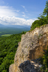Summer, mountainous terrain, hiking trails running through the park, a place for walking and recreation.