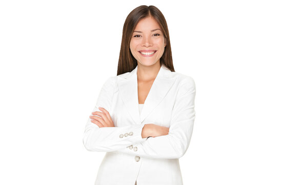 Confident smiling young Asian businesswoman in a stylish white suit standing with her arms folded isolated cutout PNG on transparent background.