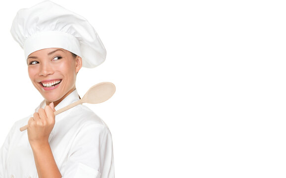 Chef woman smiling happy. Cook, chef or baker looking over should at copy space holding wooden spoon. Beautiful fresh Asian Caucasian female model isolated cutout PNG on transparent background.