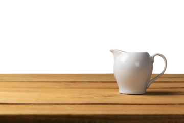 Wooden table with a ceramic teapot