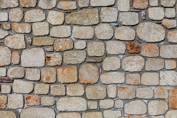 close up of the walls made of stone , stone background.