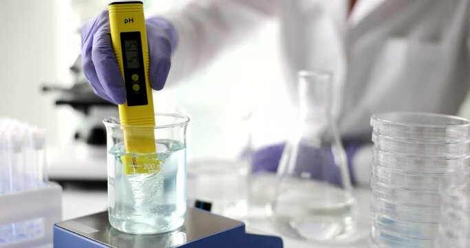 Digital water test in hand of scientist water analysis technology