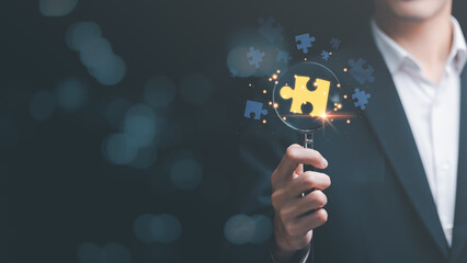 solution concept and leadership strategies,problem solution success,visionary decisions for success,finding a business solution,success and strategy concept,businessman holding a magnifying glass