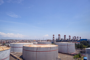 Arial view of power plant project with blue sky and cloudy vibes. The photo is suitable to use for industry background photography, power plant poster and electricity content media.