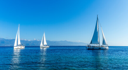 sailing yacht boats with white sails in blue sea , seascape of beautiful ships in sea gulf with...