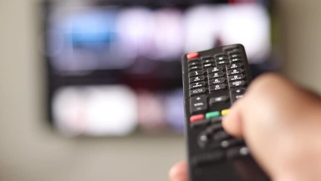 tv remote control in hand