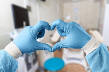 Medical doctor hands in heart form.