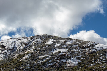 Fototapeta na wymiar Snow capped rocky mountain. Winter landscape.