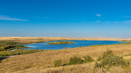 Fototapeta premium Scenic summertime views from Police Outpost Lake Provincial Park, on the border of Alberta Canada, and Montana USA