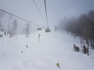 Fototapeta na wymiar ski lift, recreation in the mountains skiing or snowboarding