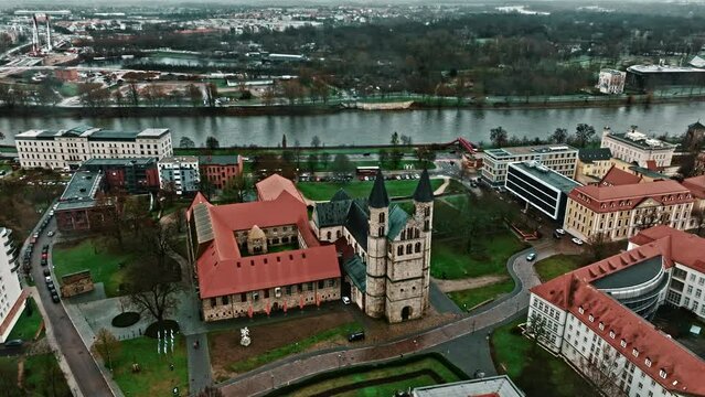 Drone shot revealing Kloster church (Klosterkirche) near Kunstmuseum Magdeburg - Kloster Unser Lieben Frauen (Kunstmuseum Magdeburg - Monastery Of Our Lady) , Magdeburg, Germany