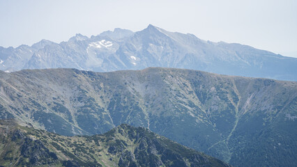 Obraz premium Prominent mountain range peak towering above layers of smaller mountains, EU, Slovakia