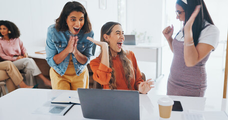 Fototapeta na wymiar Success, fist bump or happy employees with a handshake in celebration of digital marketing sales goals at office desk. Laptop, winner or excited women celebrate winning an online business deal at job