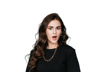 Surprised Brunette hispanic young woman in black sweatshirt looks at camera with wide opened eyes and mouth amazed by discount. Caucasian girl against transparent background. Excited female blogger.