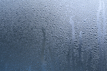 large drops of water on the glass. condensate.