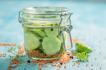 Healthy pickled cucumber with allspice and mustard. - obrazy, fototapety, plakaty