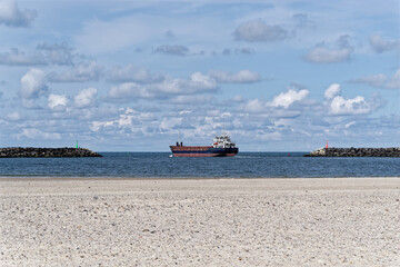 General cargo ship ship leaving port of Hvide Sande in Denmark - 567986875