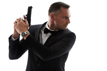 Spy, gun and secret agent model with isolated, white background and mockup ready for action. Actor, weapon and tuxedo suit of a man looking mysterious with classy style and pistol for danger