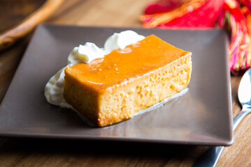 Egg flan with a little cream on the side.