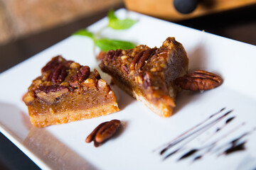 Dark chocolate dessert with nuts in a French patisserie.