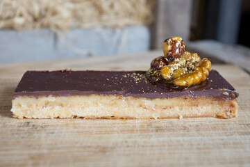 Dark chocolate dessert with nuts in a French patisserie.