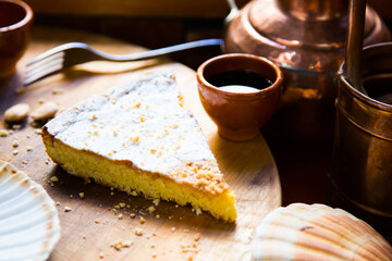 Tarta de Santiago. It is the most representative cake of Galicia, whose ingredients are: almonds, sugar, eggs and lemon zest.