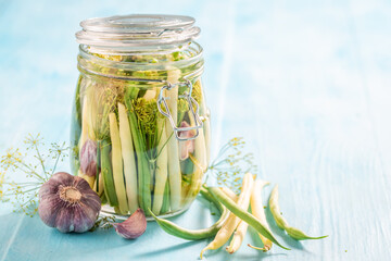 Healthy canned yellow and green beans with galic and dill.