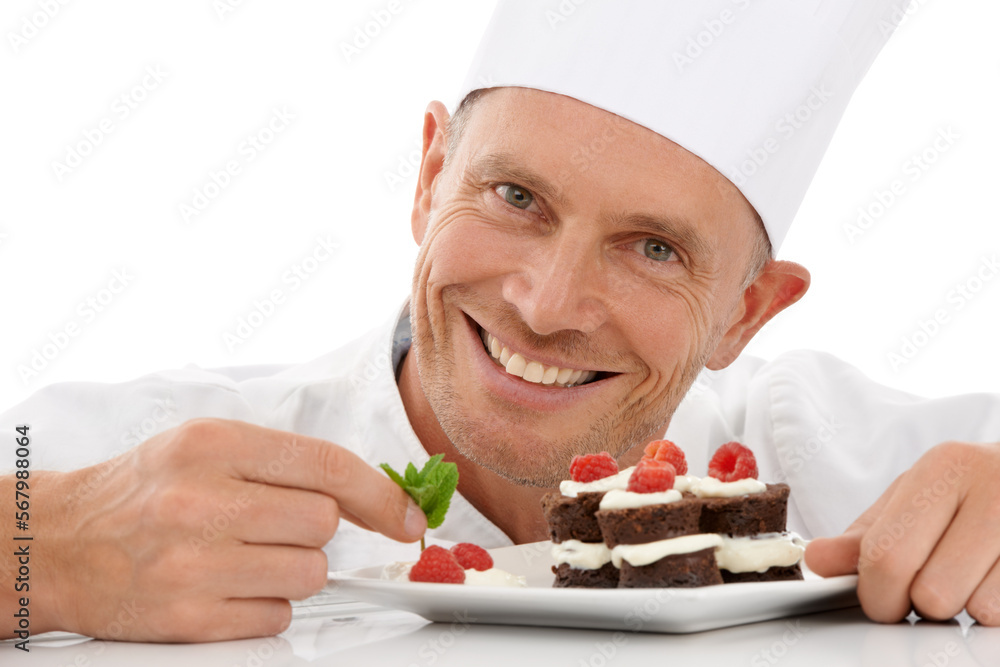 Wall mural Bakery, baking and portrait of a chef with cake presentation isolated on a white background in a studio. Fruit, food and face of a professional baker with a sweet chocolate dessert for catering