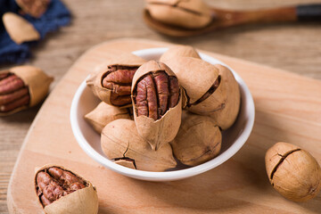 pecan nuts on wooden table