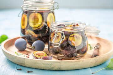 Sweet and tasty pickled plums in sugar and vinegar.