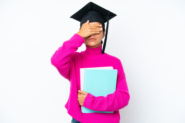 Young student hispanic woman holding a books isolated on white background covering eyes by hands. Do not want to see something