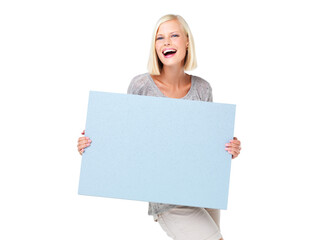 Fototapeta premium Mockup, advertising and woman with a poster marketing, news and billboard for sale, deal or giveaway. Portrait, blonde and female showing brand on a board isolated in a studio white background