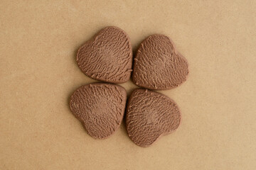 Four heart shaped cookies. Chocolate cookies in shape of hearts, close-up. Love banner concept, Hearts Valentine's Day Greeting Card Background