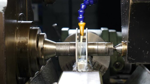 Lathing proccess. Metallurgy Lathe Cutting Steel Detail Producing Metal Shavings. Automated Manufacturing Of Components By Lathe Machine For Metal Cutting. Producing derrick equipment, 4 k video
