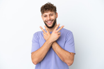 Fototapeta na wymiar Young handsome caucasian man isolated on white background smiling and showing victory sign