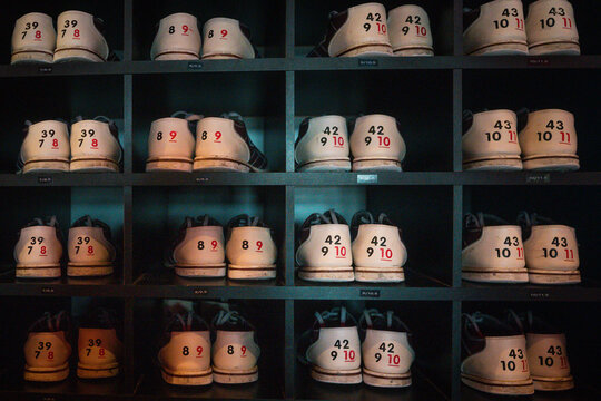 Shadowed cubbies of retro bowling shoes