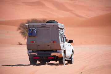 4x4 suv vehicle rides through the sand dune Namib desert - Namibia © muratart