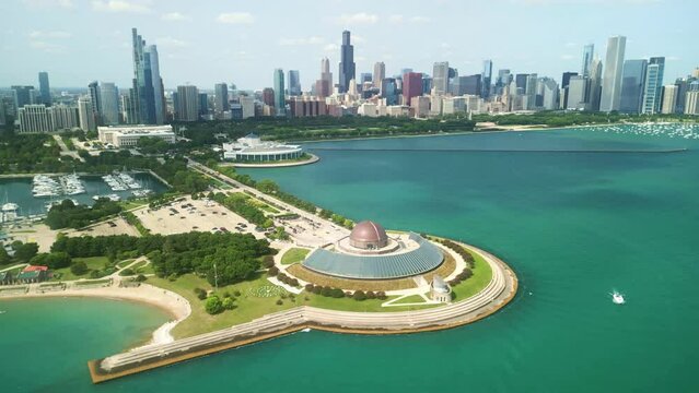 Chicago skyline aerial drone view from above, Adler Planetarium, lake Michigan, city of Chicago downtown skyscrapers cityscape.