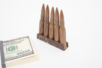 US dollars pack with weapons.